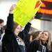 Chelsea seniors Lisa Keene, left, and Megan Hall, stand with a sign supports hockey players Joe Hewitt (15) and Joey Olmsted (16) during the MHSAA semi-finals against Grosse Pointe Woods University Liggett. Angela J. Cesere | AnnArbor.com
