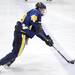 Chelsea's Kody Johnson takes the puck down the ice. Angela J. Cesere | AnnArbor.com
