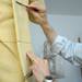 Sculptor Tony Frudakis smoothes out the urethane foam on Thomas Jefferson's jacket.  Angela J. Cesere | AnnArbor.com