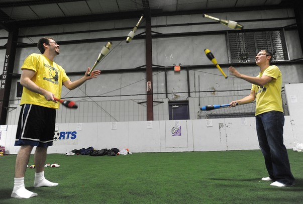 John Glenn High School juggling club members Kyle Felker, right, a senior, juggles pins with Jeff Tuck, a counselor at the school, during the Ann Arbor Juggling Arts Festival at Wide World of Sports in Ann Arbor.  Angela J. Cesere | AnnArbor.com