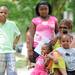 Clockwise from right: Kim Wilson-Ruffin, right, sits with her grandchildren Kimareah Steward, age 5, Lenora Steward, age 2, Elijah Steward, age 9, and Aaliyah Steward, age 10, while listening to a story during the 18th Juneteenth celebration at Wheeler Park in Ann Arbor. Juneteenth is the celebration of June 19, 1865, when Africans in Texas and the Southwest were told of the abolition of slavery and their subsequent freedom. The event features live music, games, food and other activities. Angela J. Cesere | AnnArbor.com