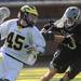 Michigan's Will Meter, left, tries to avoid Bellarmine's Reid Wesley as he heads toward the goal. Angela J. Cesere | AnnArbor.com
