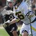 Michigan's Willie Steenland, right, fights past Bellarmine's William Wersel. Angela J. Cesere | AnnArbor.com
