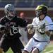Michigan's Alex Vasileff looks for a path around Bellarmine's Ryan Scinta. Angela J. Cesere | AnnArbor.com
