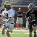  Michigan's Thomas Paras, left, looks for a pass around Bellarmine's Will Cary. Angela J. Cesere | AnnArbor.com

