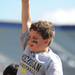 Michigan fan Geoffrey George Ferich Jr., age 8, cheers after the lacrosse team scored a goal. Angela J. Cesere | AnnArbor.com
