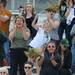 The Huron fan section cheers after a goal was scored, closing the gap between Huron and Pioneer from 3 - 10 in the first half to 10 - 11 with 7 minutes to go during the lacrosse quarter finals game at South Lyon High School. Angela J. Cesere | AnnArbor.com