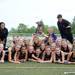 The Pioneer lacrosse team poses for a photo with their trophy after winning the MHSAA quarter finals match against Huron, 10 - 11 at South Lyon High School. Angela J. Cesere | AnnArbor.com