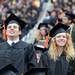 University of Michigan students Sean Grant, left, and Samantha Loux stand as College of Engineering graduates are announced during the commencement ceremony. Angela J. Cesere | AnnArbor.com