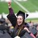 Emily Berman cheers after the School of Music, Theater, and Dance graduates are announced during commencement. Angela J. Cesere | AnnArbor.com