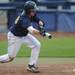 Michigan freshman Dylan Delaney bunts. Angela J. Cesere | AnnArbor.com
