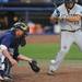 Michigan senior catcher Coley Crank catches a pitch against Coastal Carolina batter Chris Suseck. Angela J. Cesere | AnnArbor.com