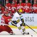 Michigan forward Chris Brown skates past Miami of Ohio defenseman Ben Paulides with the puck. Angela J. Cesere | AnnArbor.com
