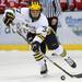 Michigan defenseman Mac Bennett takes the puck down the ice. Angela J. Cesere | AnnArbor.com
