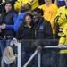 Michigan football quarterback Denard Robinson poses for a photo with 16-year-old Milwaukee resident Kendall Youngblood, while Michigan student Michelle Roberts photographs them. Angela J. Cesere | AnnArbor.com
