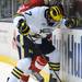 Michigan forward Phil Di Giuseppe fights for the puck against Miami of Ohio defenseman Steven Spinell. Angela J. Cesere | AnnArbor.com
