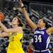 Michigan guard Kate Thompson takes a shot, left, while Northwestern guard Tailor Jones tries to block her.  Angela J. Cesere | AnnArbor.com
