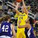 Michigan guard Jenny Ryan, center, takes a shot above Northwestern guard Morgan Jones, right, and guard Karly Roser. Angela J. Cesere | AnnArbor.com
