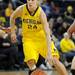 Michigan guard Jenny Ryan dribbles down the court. Angela J. Cesere | AnnArbor.com
