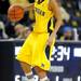 Michigan guard Brenae Harris dribbles the ball in the first half. Angela J. Cesere | AnnArbor.com
