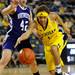 Michigan guard Brenae Harris tries to maintain control of the ball while Northwestern guard Karly Roser guards against her. Angela J. Cesere | AnnArbor.com
