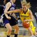 Michigan guard Courtney Boylan tries to dribble past Northwestern guard Karly Roser.  Angela J. Cesere | AnnArbor.com