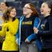From left: 10-year-old Canton residents Nicole O'Connor, Abby Witten, and Isabel Anderson dance for the video screen during the basketball game against Northwestern. Angela J. Cesere | AnnArbor.com