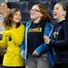 From left: 10-year-old Canton residents Nicole O'Connor, Abby Witten, and Isabel Anderson dance for the video screen during the basketball game against Northwestern. Angela J. Cesere | AnnArbor.com
