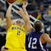 Northwestern guard Alison Mocchi, right, tries to block a shot by Michigan guard Courtney Boylan. Angela J. Cesere | AnnArbor.com
