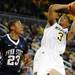 Michigan guard Trey Burke goes up for a shot while Penn State guard Tim Frazier watches. Angela J. Cesere | AnnArbor.com