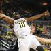 Michigan guard Tim Hardaway Jr. is fouled by Penn State forward Billy Oliver. Angela J. Cesere | AnnArbor.com