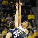 Michigan forward Jordan Morgan and Penn State forward Billy Oliver face off for the jump ball. Angela J. Cesere | AnnArbor.com