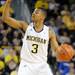 Michigan guard Trey Burke signals a play. Angela J. Cesere | AnnArbor.com