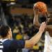 Penn State guard Matt Glover, left, tries to block a pass by Michigan guard Tim Hardaway Jr. Angela J. Cesere | AnnArbor.com