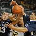 Penn State guard Matt Glover, right, and forward Ross Travis, left, fight Michigan forward Jordan Morgan for a rebound. Angela J. Cesere | AnnArbor.com