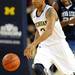 Michigan guard Trey Burke dribbles down the court. Angela J. Cesere | AnnArbor.com