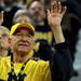 Canton resident "True Blue" Tom Malden puts up his hands to cheer. Angela J. Cesere | AnnArbor.com