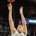 Michigan guard Stu Douglass jumps up for a shot. Angela J. Cesere | AnnArbor.com