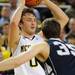 Michigan guard Zack Novak looks for a pass around Penn State forward Billy Oliver. Angela J. Cesere | AnnArbor.com