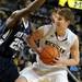 Penn State forward Jon Graham tries to block Michigan forward Evan Smotrycz. Angela J. Cesere | AnnArbor.com