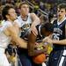 Michigan guard Zack Novak, left and forward Evan Smotrycz fight Penn State guard Trey Lewis for the ball. Angela J. Cesere | AnnArbor.com