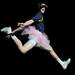 A men's baseball team member jumps in the air dressed as a ballerina during their skit. Angela J. Cesere | AnnArbor.com