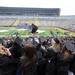 A group of soon-to-be graduates cheer before the University of Michigan class of 2012 commencement ceremony begins in Michigan Stadium. Angela J. Cesere | AnnArbor.com