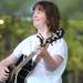 Mary Henderson plays guitar in the band No Excuses during their performance at the AnnArbor.com concert series. Angela J. Cesere | AnnArbor.com