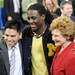 University of Michigan football quarter back Denard Robinson poses for a photo with U.S. Senator Debbie Stabenow, right, and her press secretary Matt Williams, left, before President Obama's speech. Angela J. Cesere | AnnArbor.com
