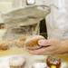 The final step is to sprinkle powdered sugar on top of the paczki if desired. Angela J. Cesere | AnnArbor.com