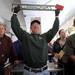 Bob Goetz, an employee of Braun and Helmer auction service, holds up a door handle for auction which was formerly on the Parthenon restaurant and Cunningham's drug store. Angela J. Cesere | AnnArbor.com
