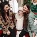 Santa reacts to the request of sophomore Nicole Barron, of West Bloomfield, for a good GPA for Christmas as her sorority sister sophomore Hillary Wiesel laughs during a Make-A-Wish event at the Chi Omega Sorority house on Tuesday.  Melanie Maxwell I AnnArbor.com