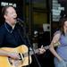 The Potter's Field's John Natiw, left, sings, plays guitar, and harmonica while Rochelle Clark sings during their performance. Angela J. Cesere | AnnArbor.com 