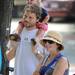 Palo Alto resident Kristy DeRemer, right, Stephan Sonnenberg, lower left, and their son, 2-year-old Milo Sonnenberg listen to the music of The Potter's Field.  Angela J. Cesere | AnnArbor.com 